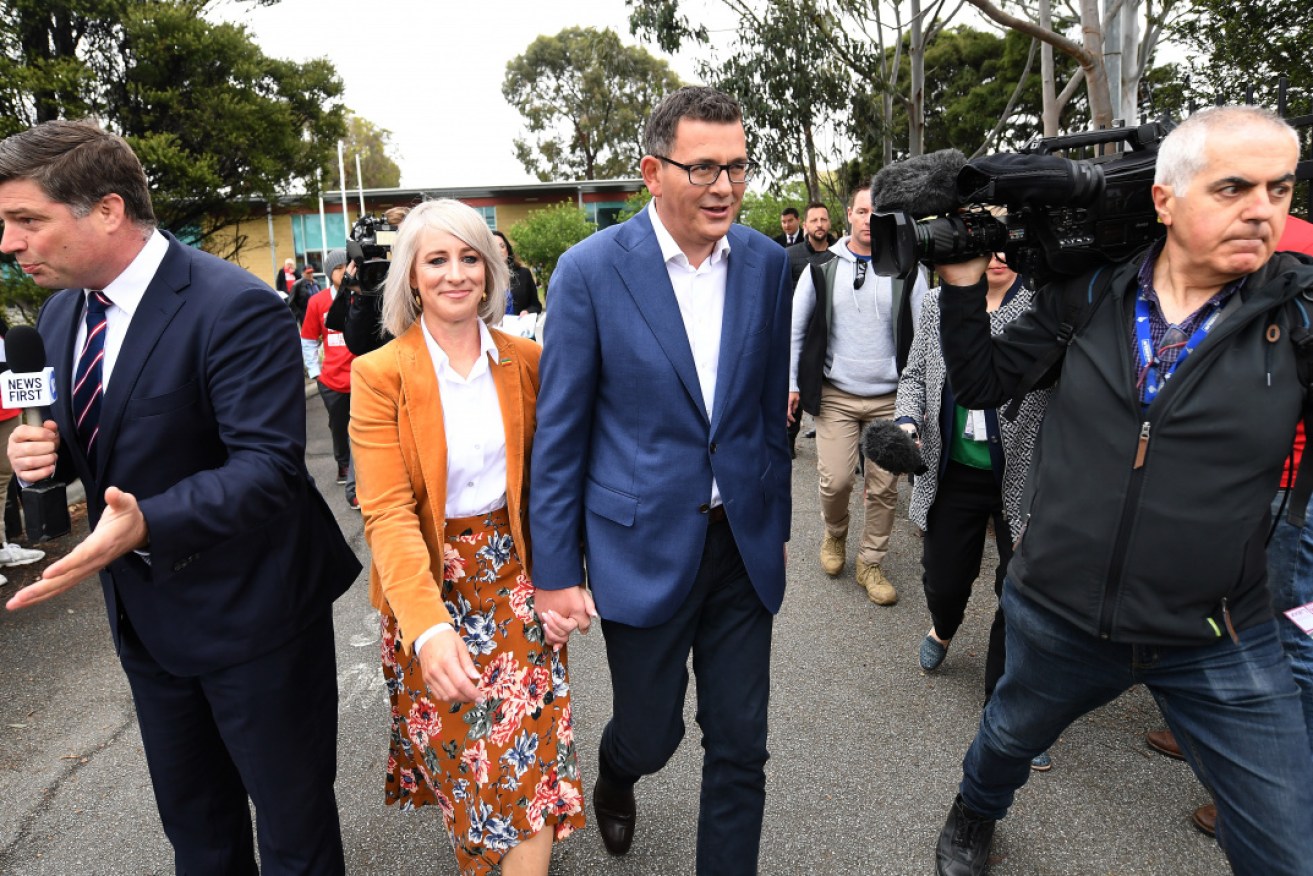 Victorian Labor leader Daniel Andrews and his wife Catherine leave Albany Rise Primary School in Mulgrave after voting.