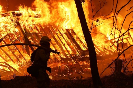 Thousands flee their homes as wind-whipped wildfires rage across US southwest