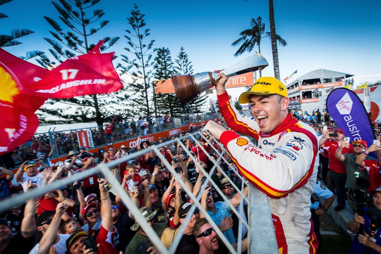 Scott McLaughlin salutes the Ford faithful after winning the Supercars title in Newcastle on Sunday. 