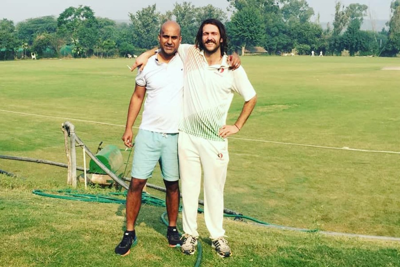 Jack Mason (right), with Melbourne friend Karthik Menon, making his international debut in Delhi on October 27.