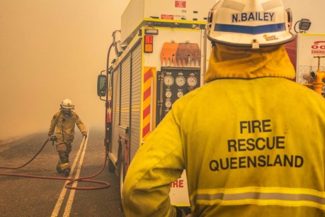 Queensland bushfires: Man, 21, dies clearing fire break as children rescued from mountain top