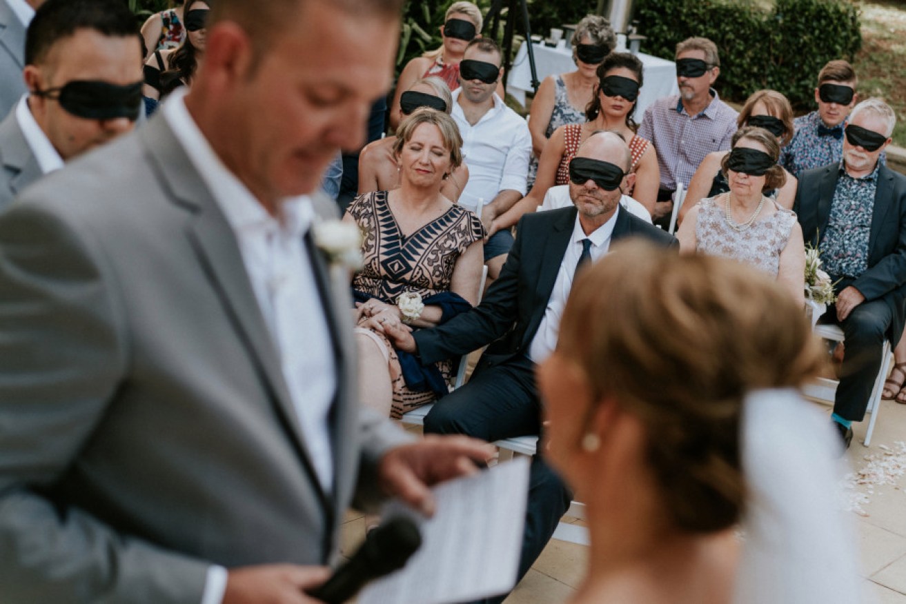 Guests wore blindfolds during Steph and Rob's wedding ceremony