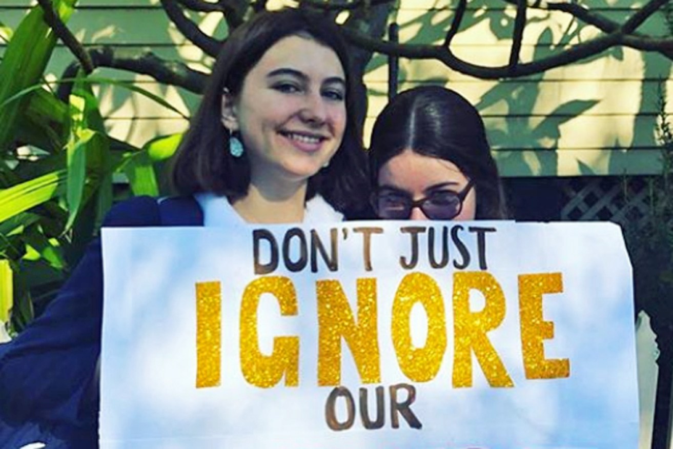 Grace (left) and Rosie leaving home for the School Strike for Climate Action on November 30.