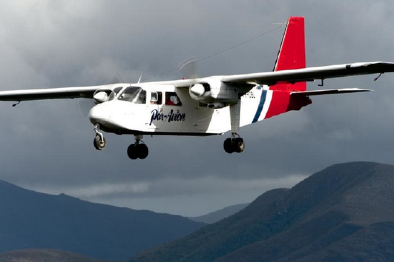 A twin-engine plane operated by air-tourist outfit Par Avion over the treacherous grandeur of southern Tasmania.
