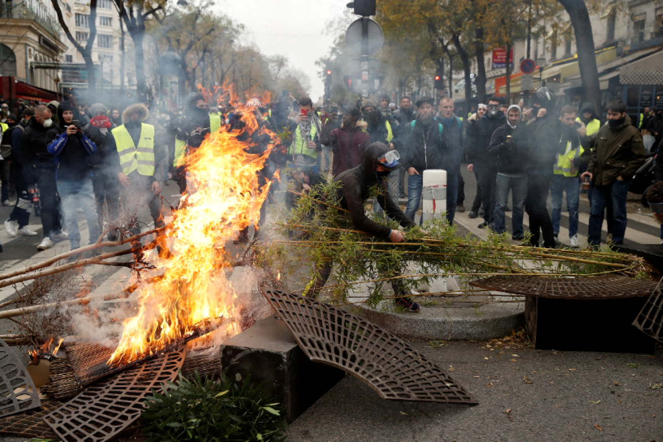Demonstrates ignite a blockading bonfire in the heart of the french Capital.