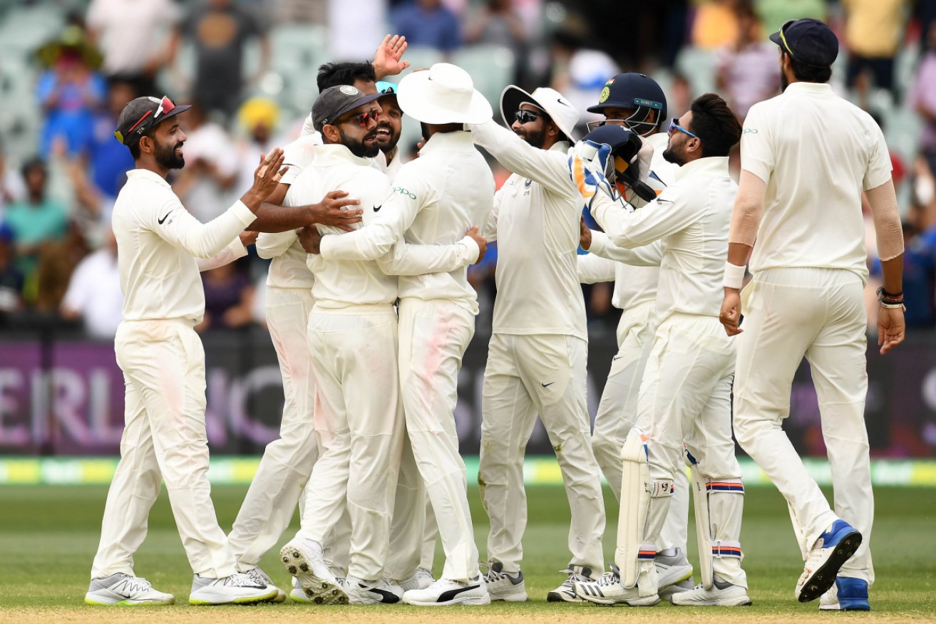 Virat Kohli's India celebrate their Test victory in Adelaide.