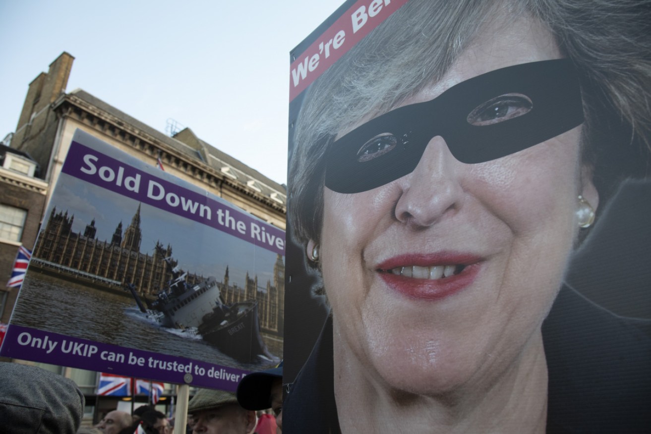 Theresa May is portrayed as a robber in a mask at the Brexit Betrayal March - Brexit Means Exit! organised by the UK 
 Independence Party on Sunday. 