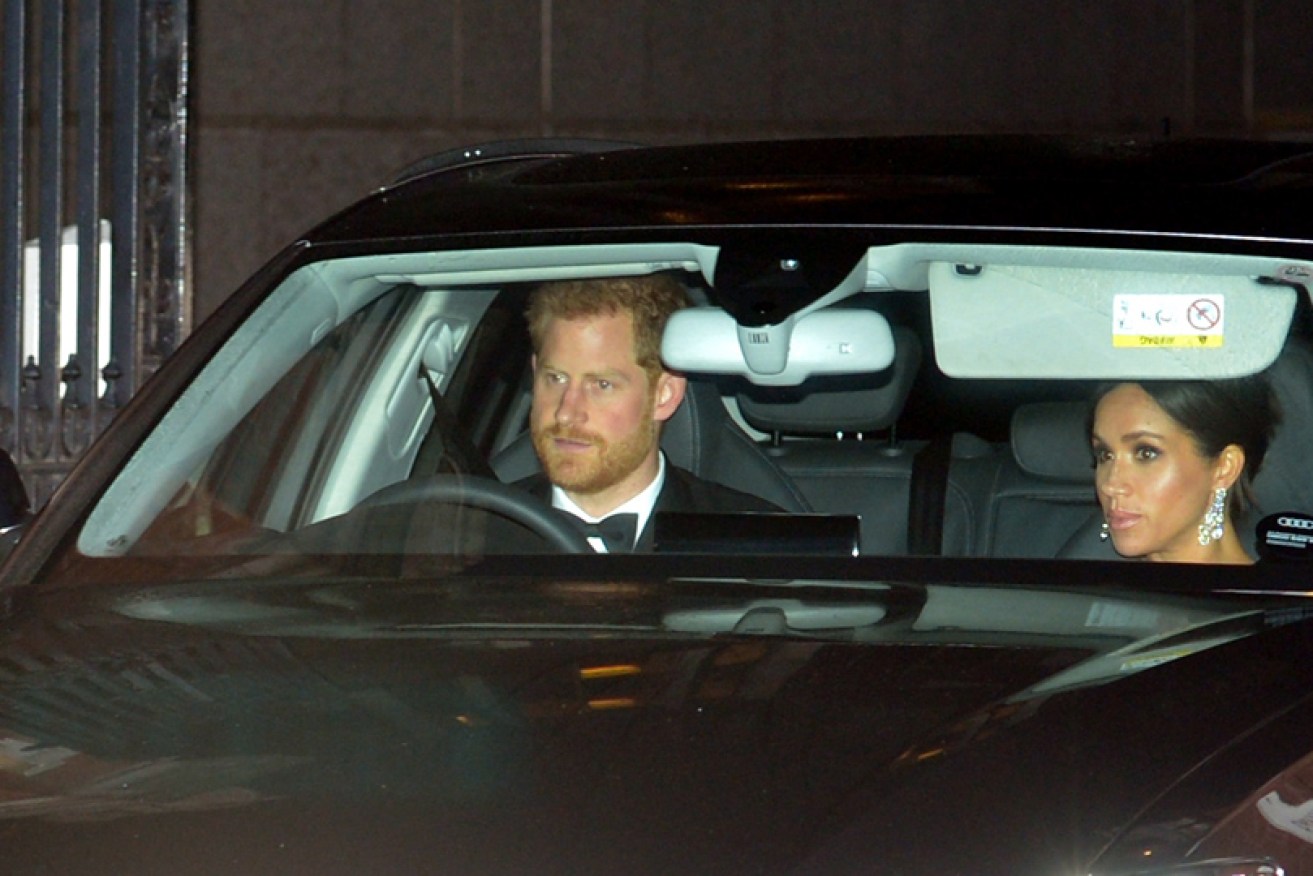Prince Harry drives the Duchess of Sussex to Prince Charles' 70h birthday party at Buckingham Palace on November 15.