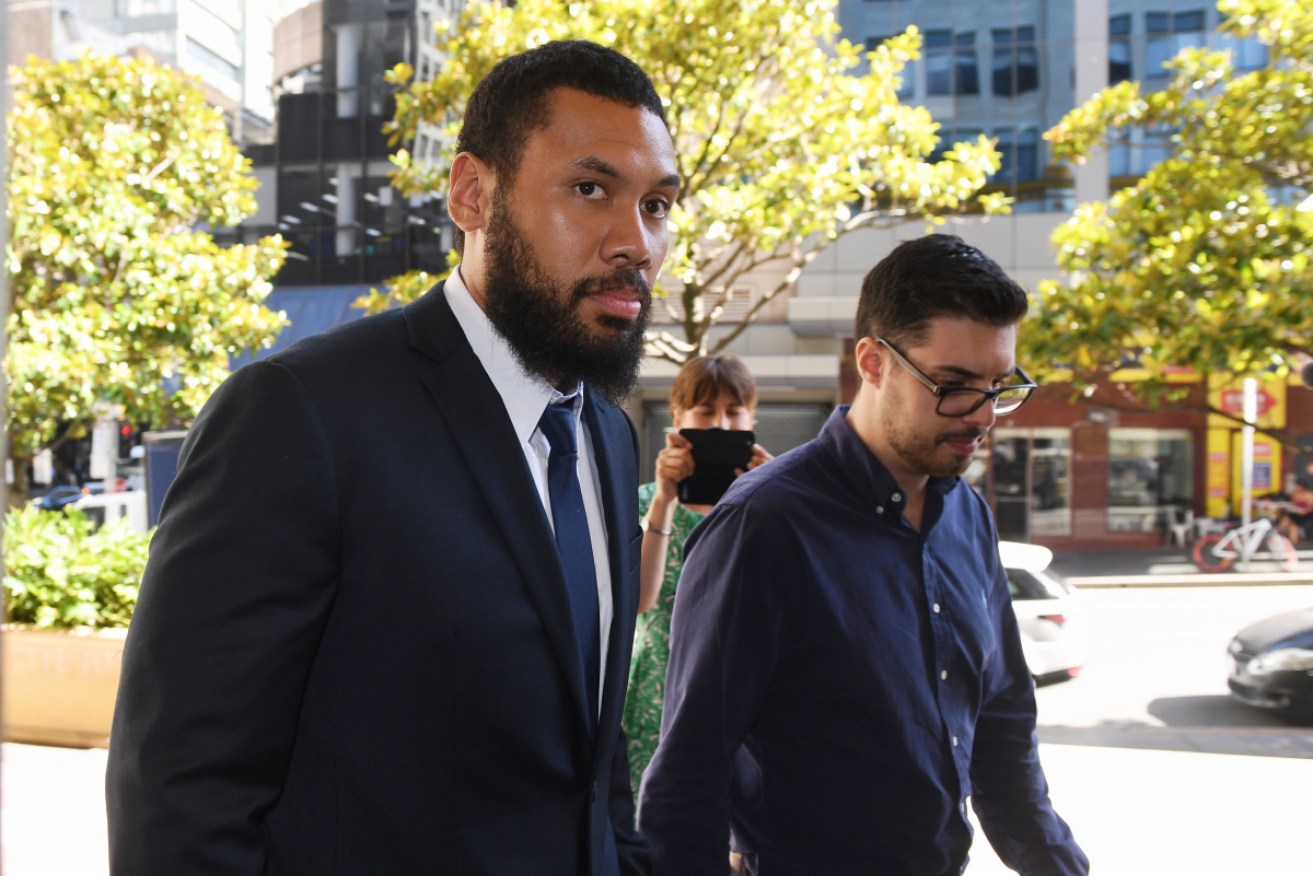 Canterbury Bankstown Bulldogs player Asipeli Fine (left) arrives at the Downing Centre Court in Sydney on Monday.