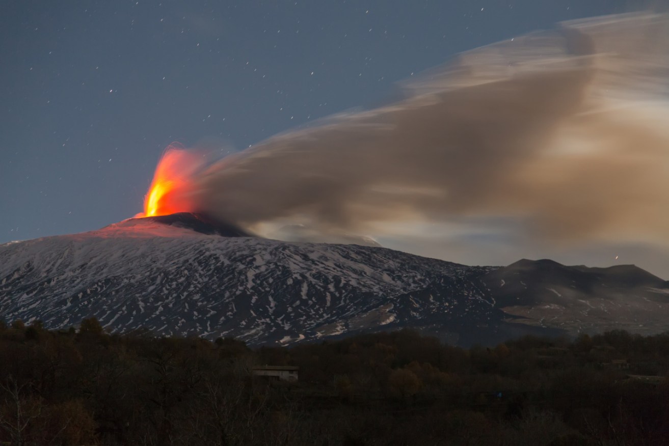 Emission of ash and explosions from the Etna volcano on Tuesday. The ash column heads towards the city of Catania.