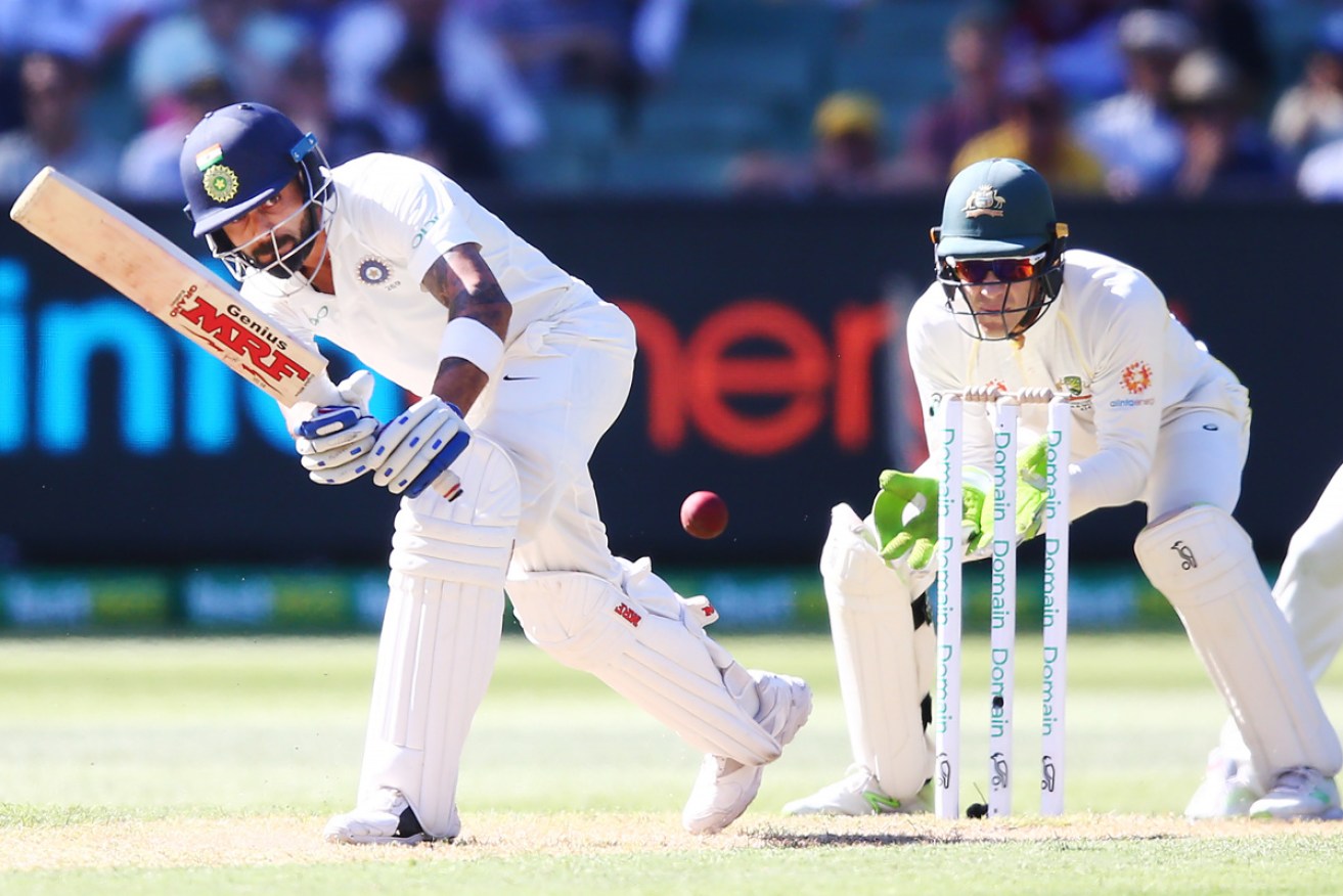 Indian skipper Virat Kohli (L) was given a life by Tim Paine late on the final day. 