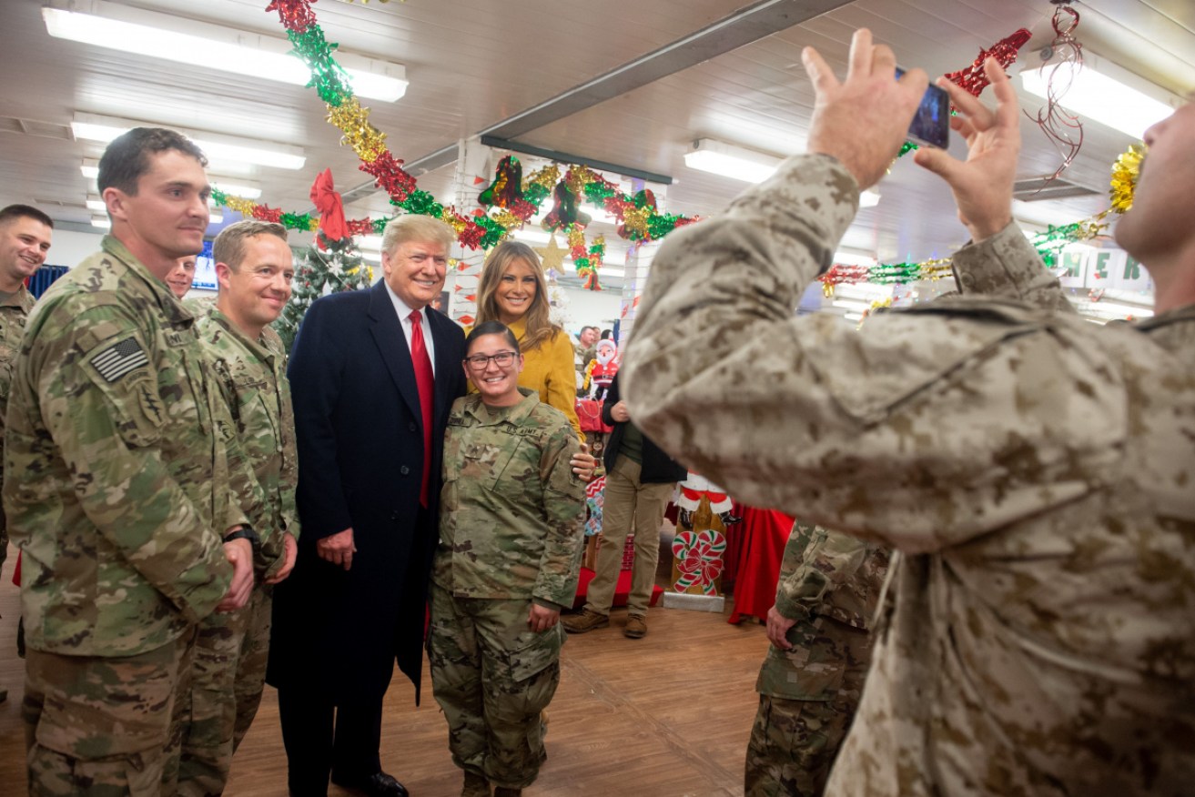 Photo opportunity: Donald Trump and wife Melania with troops in Iraq. 
