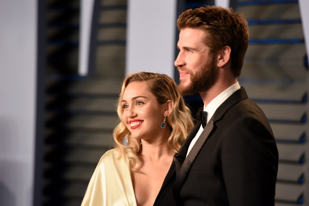 Miley Cyrus and Liam Hemsworth at the <i>Vanity Fair</i> Oscars party on March 4 in 2018.