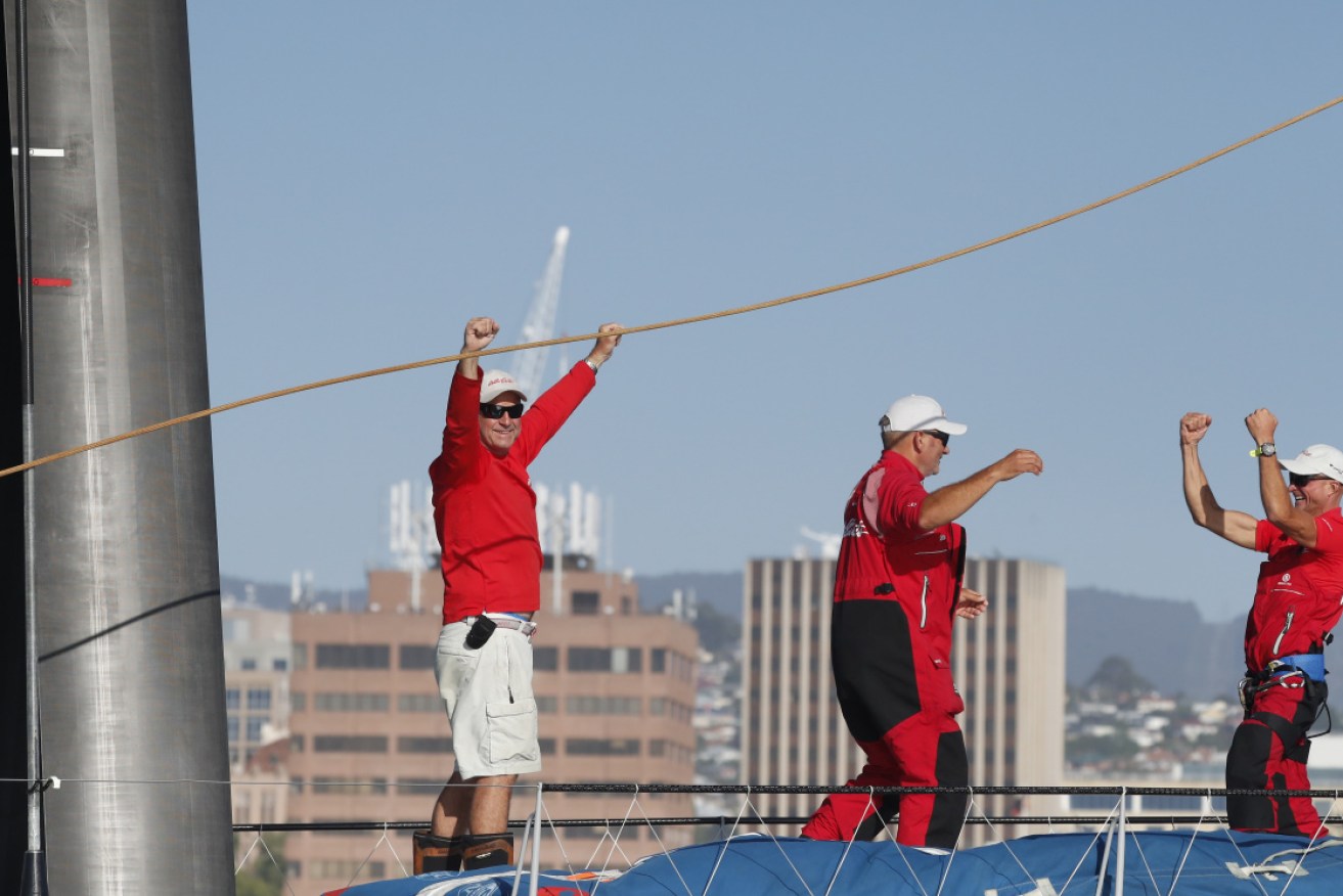 Wild Oats XI crew celebrate the win in Hobart on Friday.