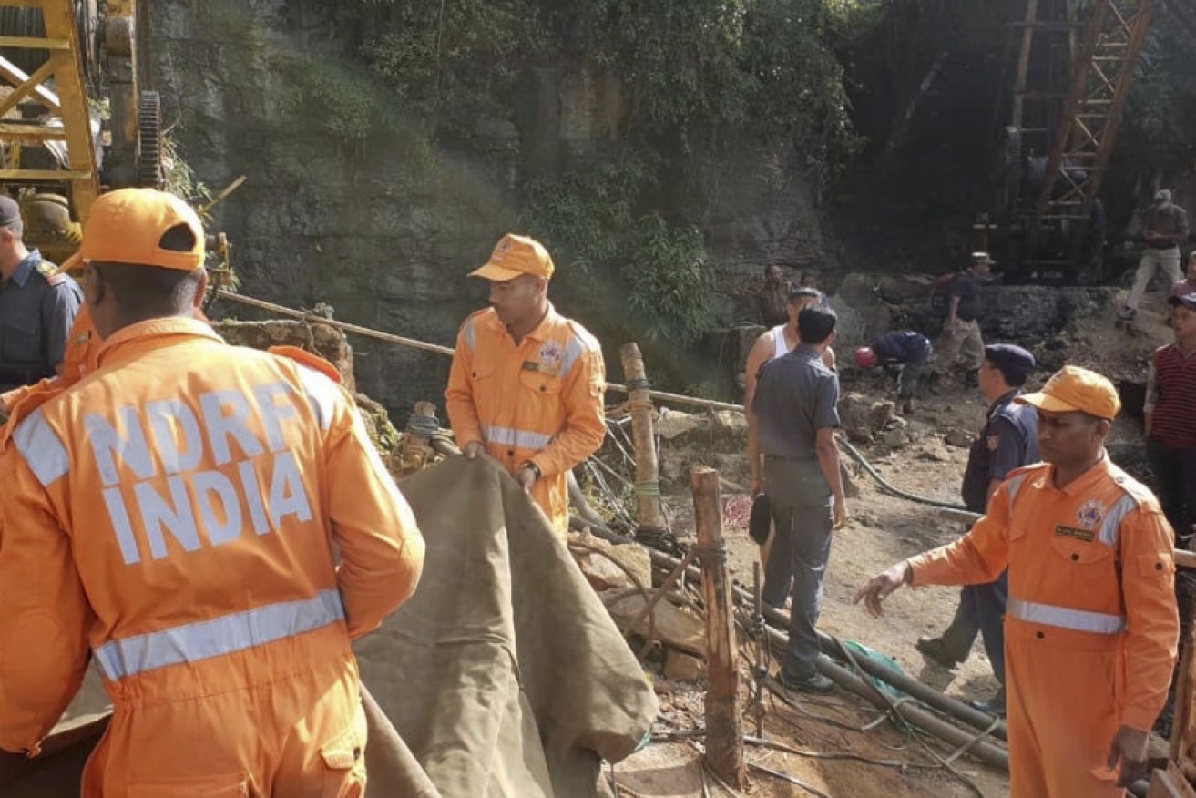 Rescuers work at the collapsed mine at Ksan on December 14 in a bid to free 15 miners feared dead following the collapse of a shaft and flooding of a coal mine.