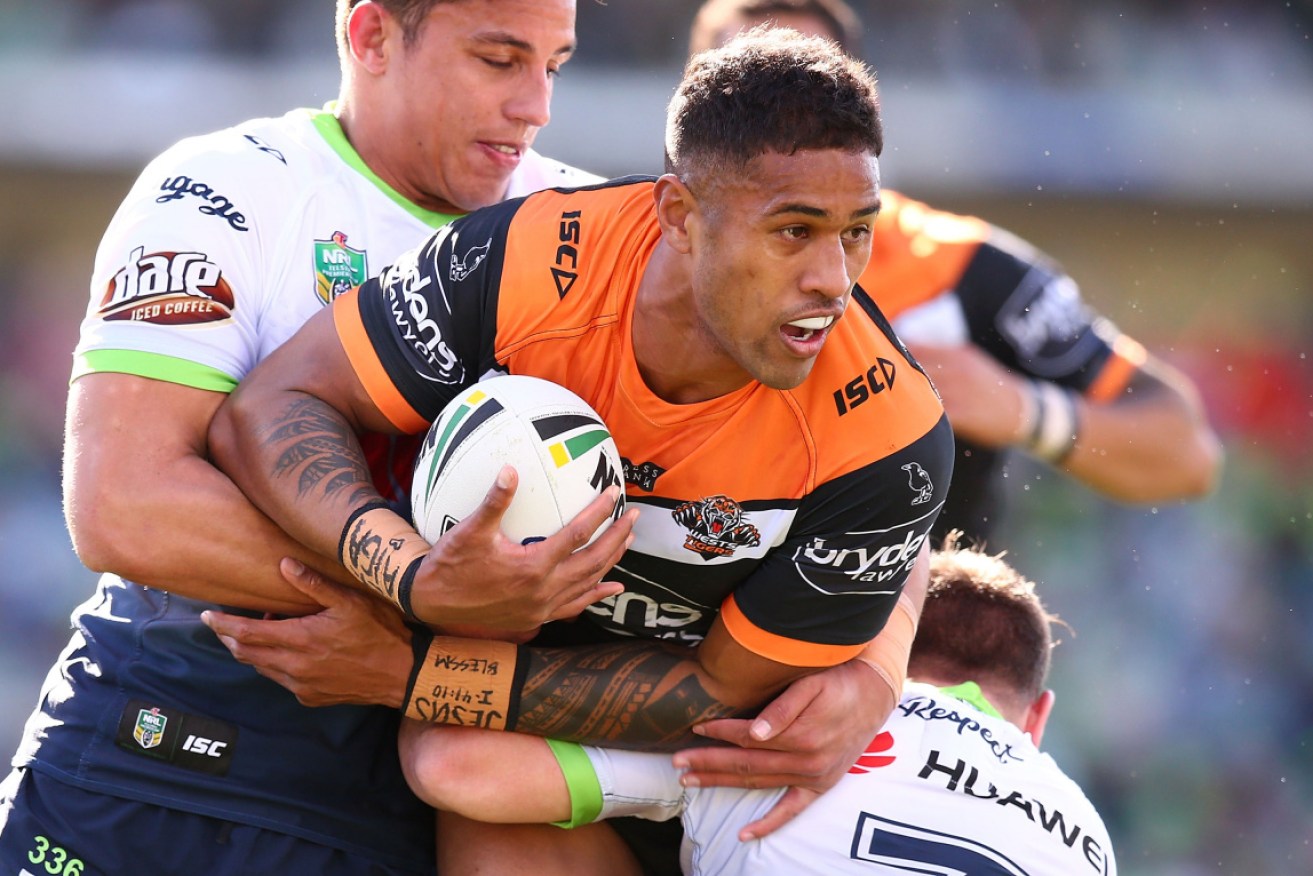 Wests Tigers player Michael Chee Kam was charged over the alleged assault of a rideshare driver.