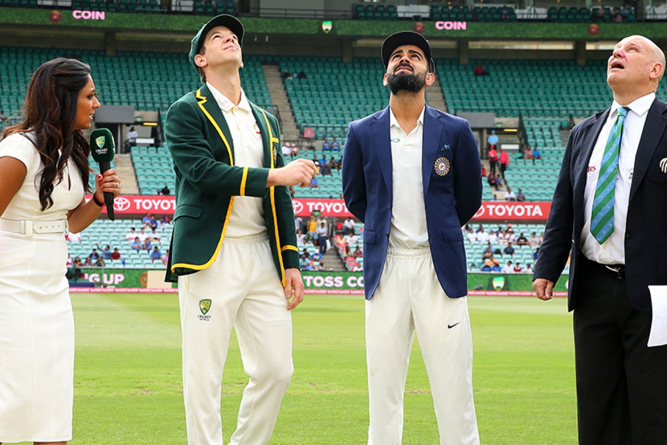 Australian captain Tim Paine and Indian skipper Virat Kohli toss the coin on day one of the fourth Test in Sydney.