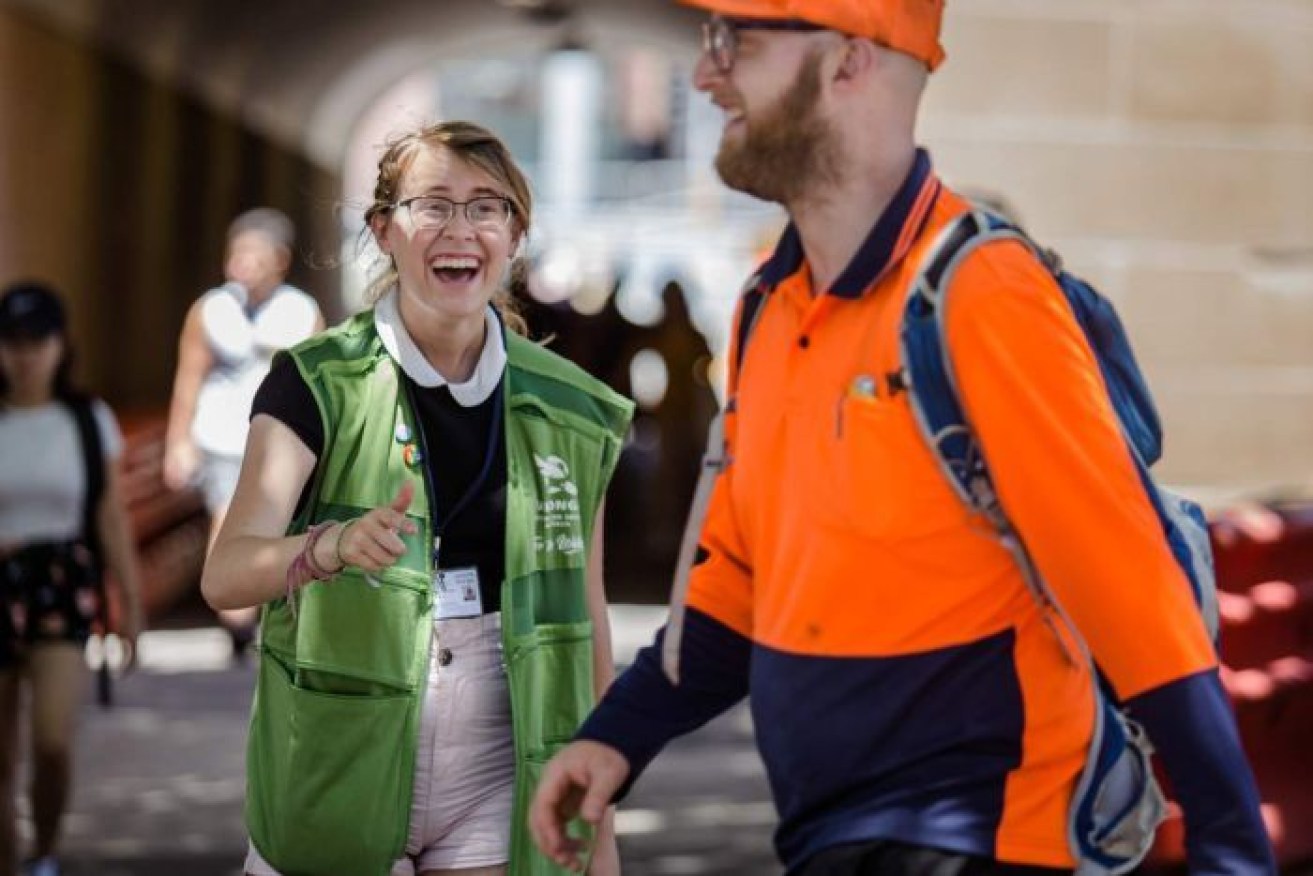 A street fundraiser makes a point to pedestrians at Sydney's Central Station.