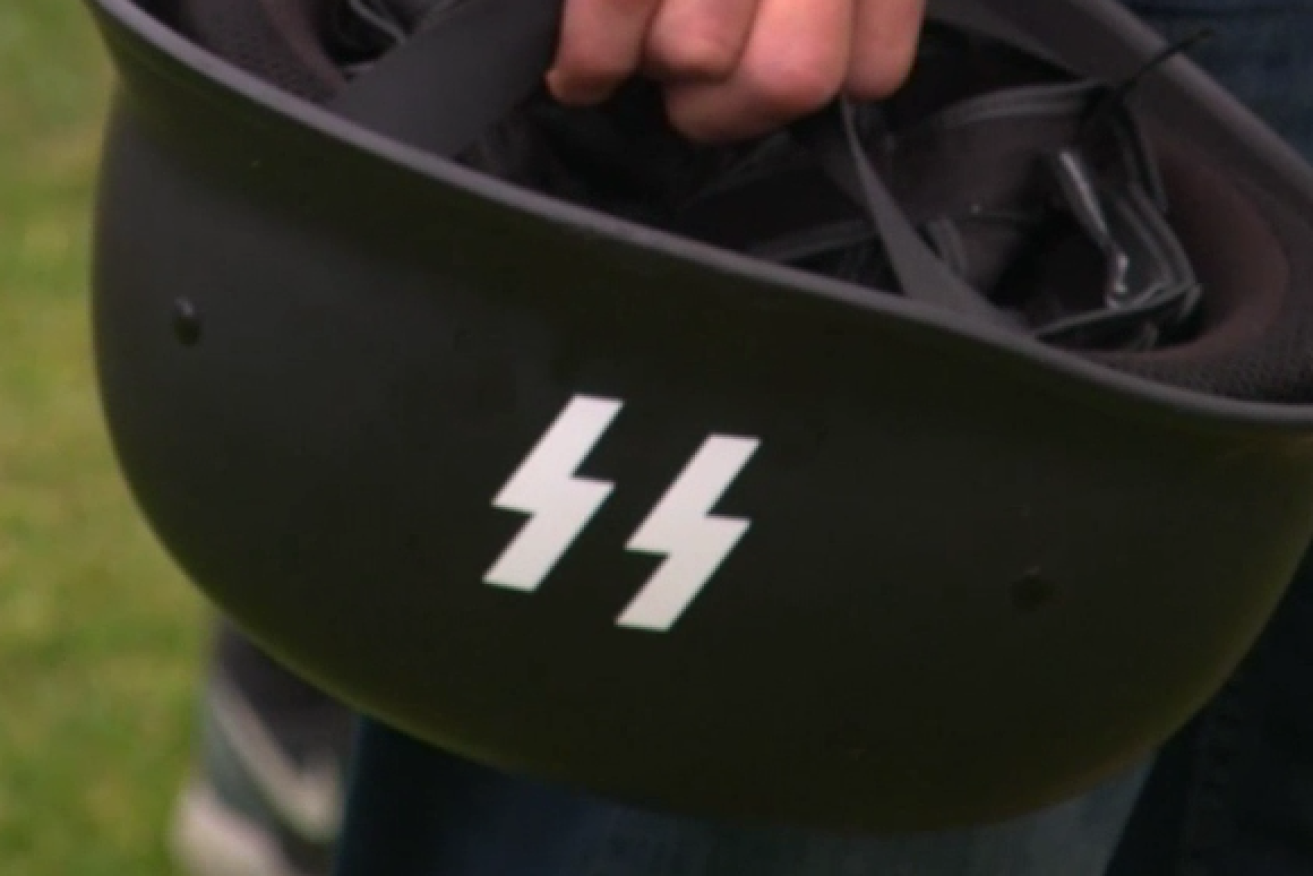 A German helmet emblazoned with the SS symbol of hate seen at the St Kilda confrontation.