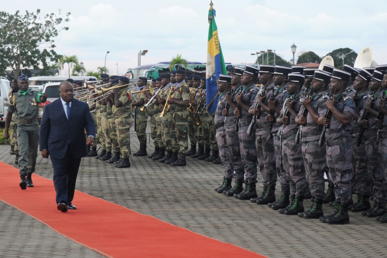 President Ali Bongo is paraded before the military in Gabon in 2017. 