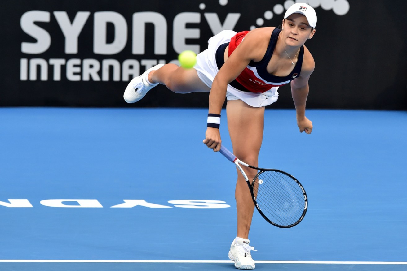Ashleigh Barty sends down a big serve at the Sydney International.