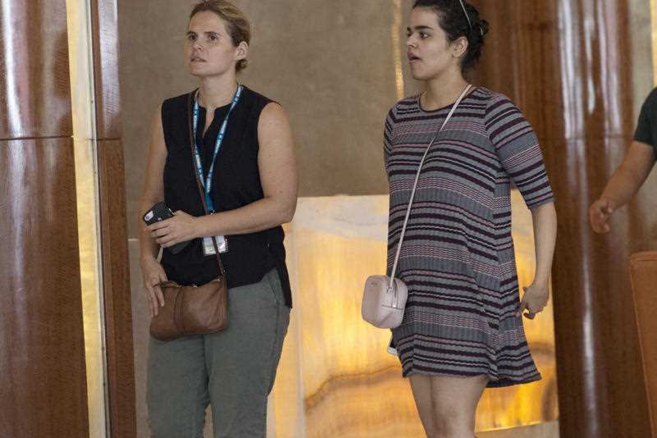 Rahaf Mohammed Alqunun (right) with an unidentified companion in Bangkok on Friday.