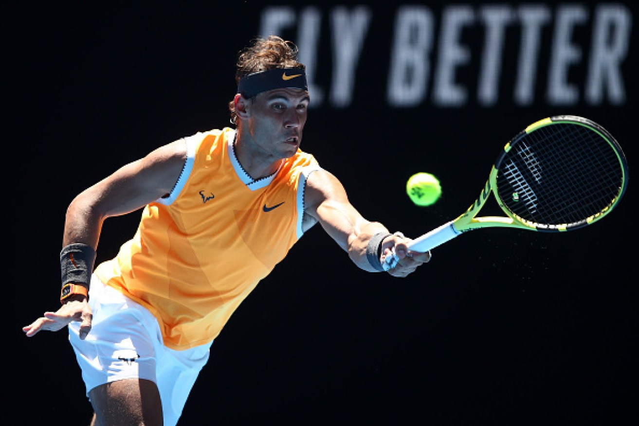 Rafael Nadal of Spain plays a forehand in his first round match against James Duckworth of Australia.   