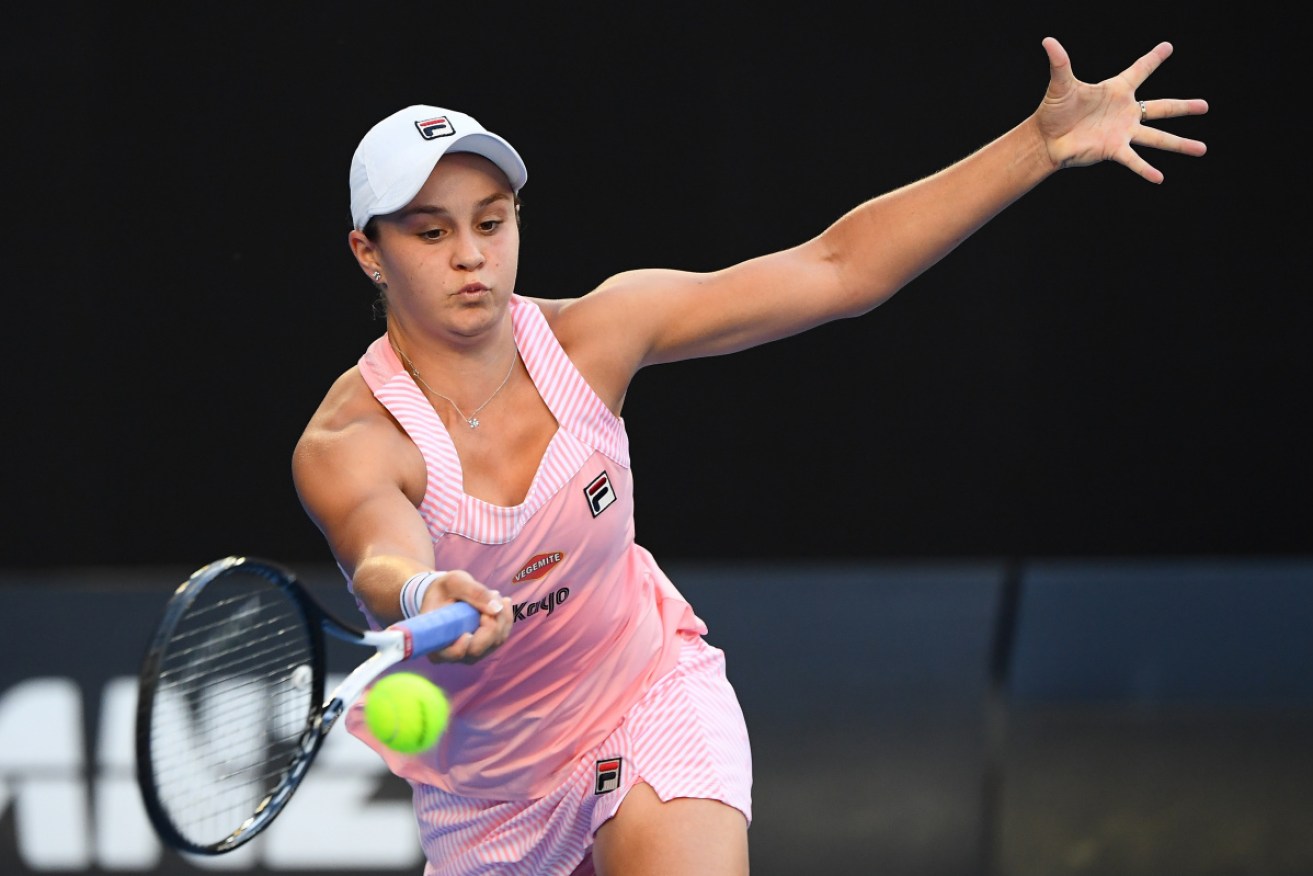 Ashleigh Barty stretches for a forehand in her first-round win over Luksika Kumkhum. 