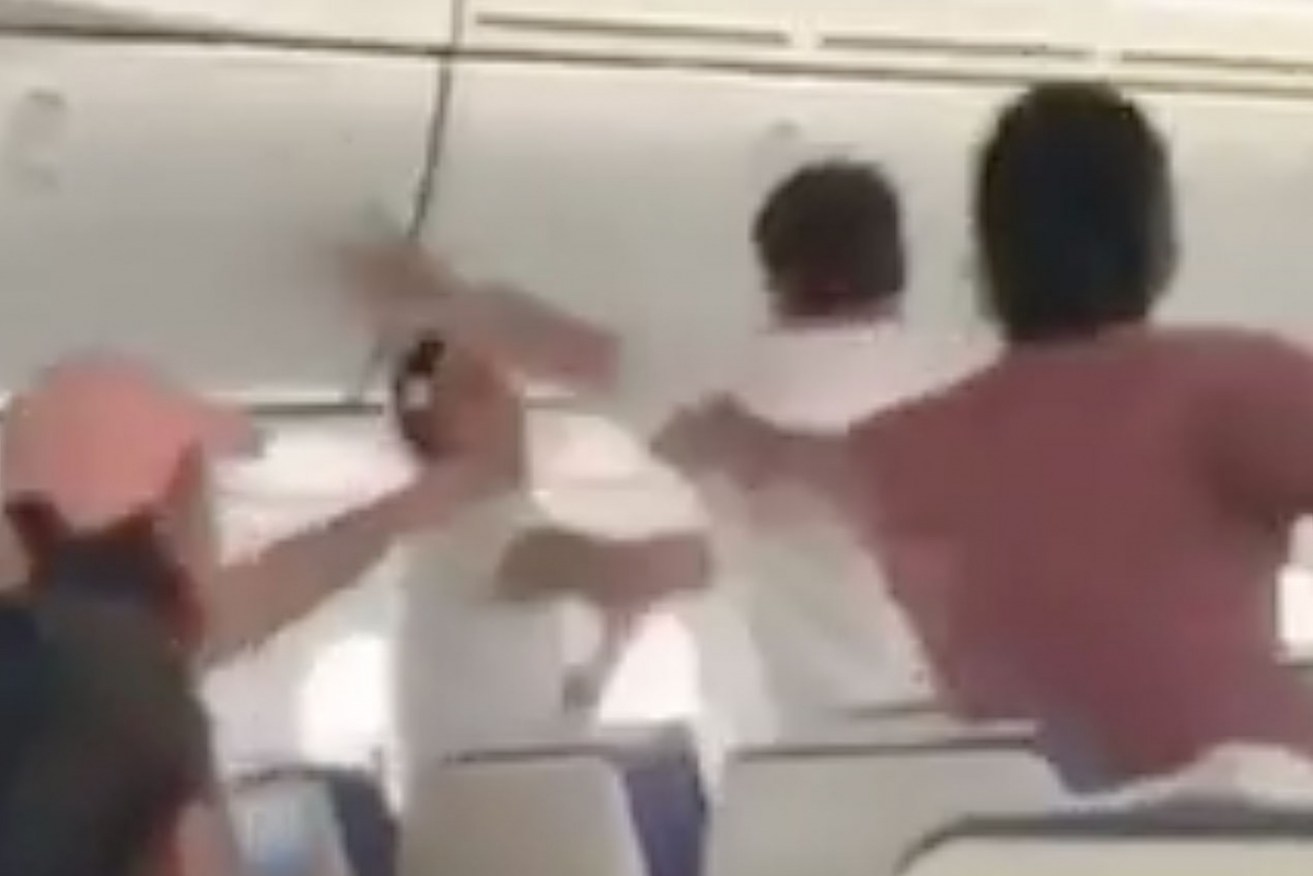Video footage showed passengers stepping in to help subdue the man.
