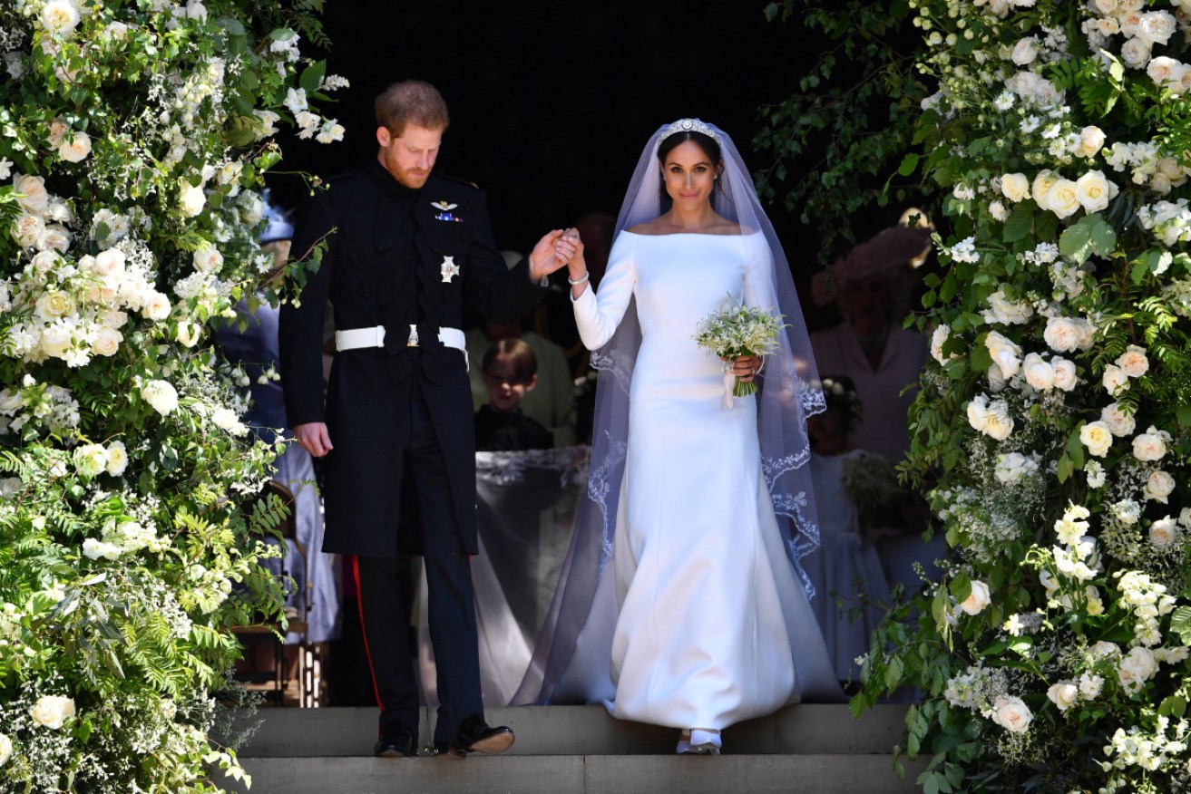 Meghan Markle and Prince Harry just after their official wedding ceremony. She says they were actually married a few days before.