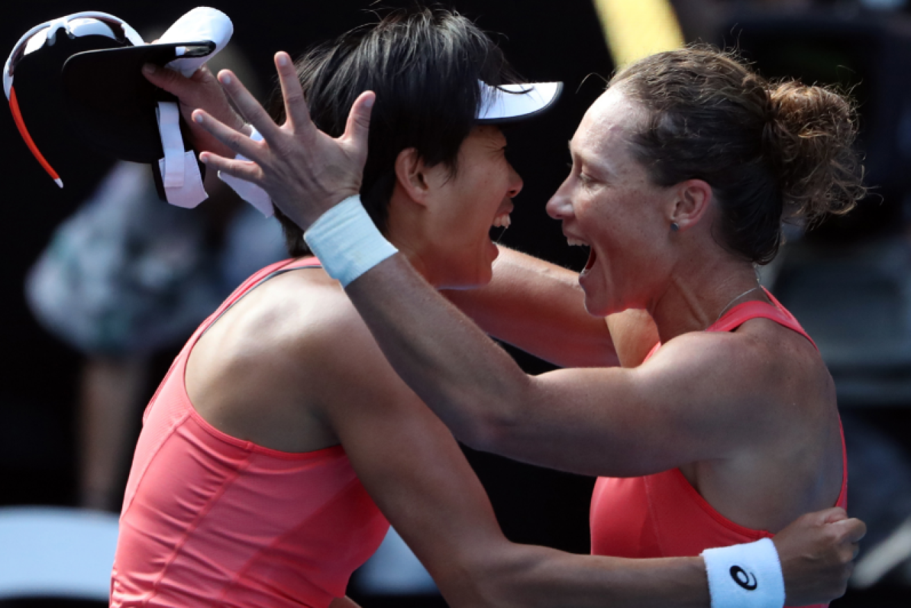Sam Stosur and Zhang Shuai celebrate their doubles crow - and the $350,000 a piece that goes with it.