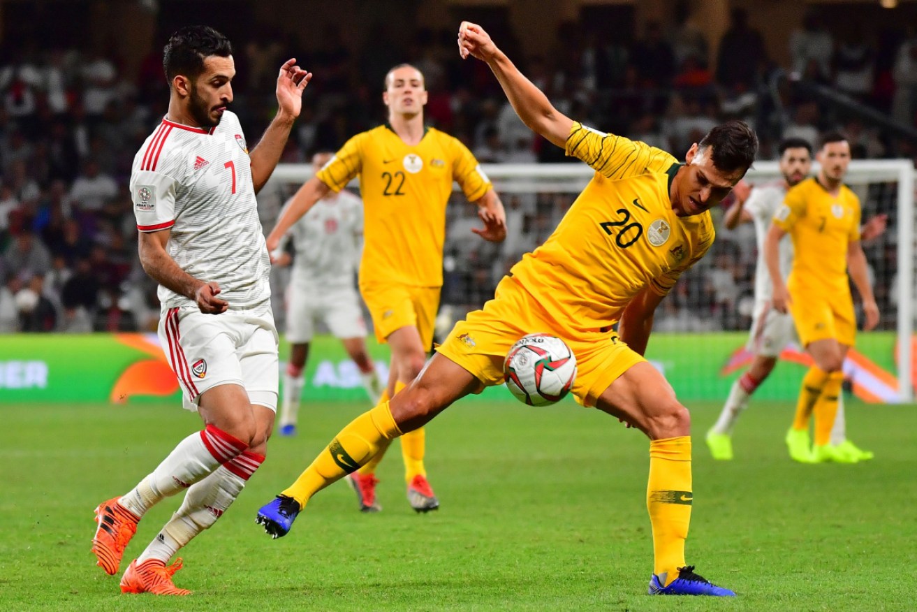 Australia's defender Trent Sainsbury (R) is marked by UAE's forward Ali Mabkhout during the 2019 AFC Asian Cup quarter-final football match between UAE and Australia at Hazaa bin Zayed Stadium in Al-Ain on January 25.