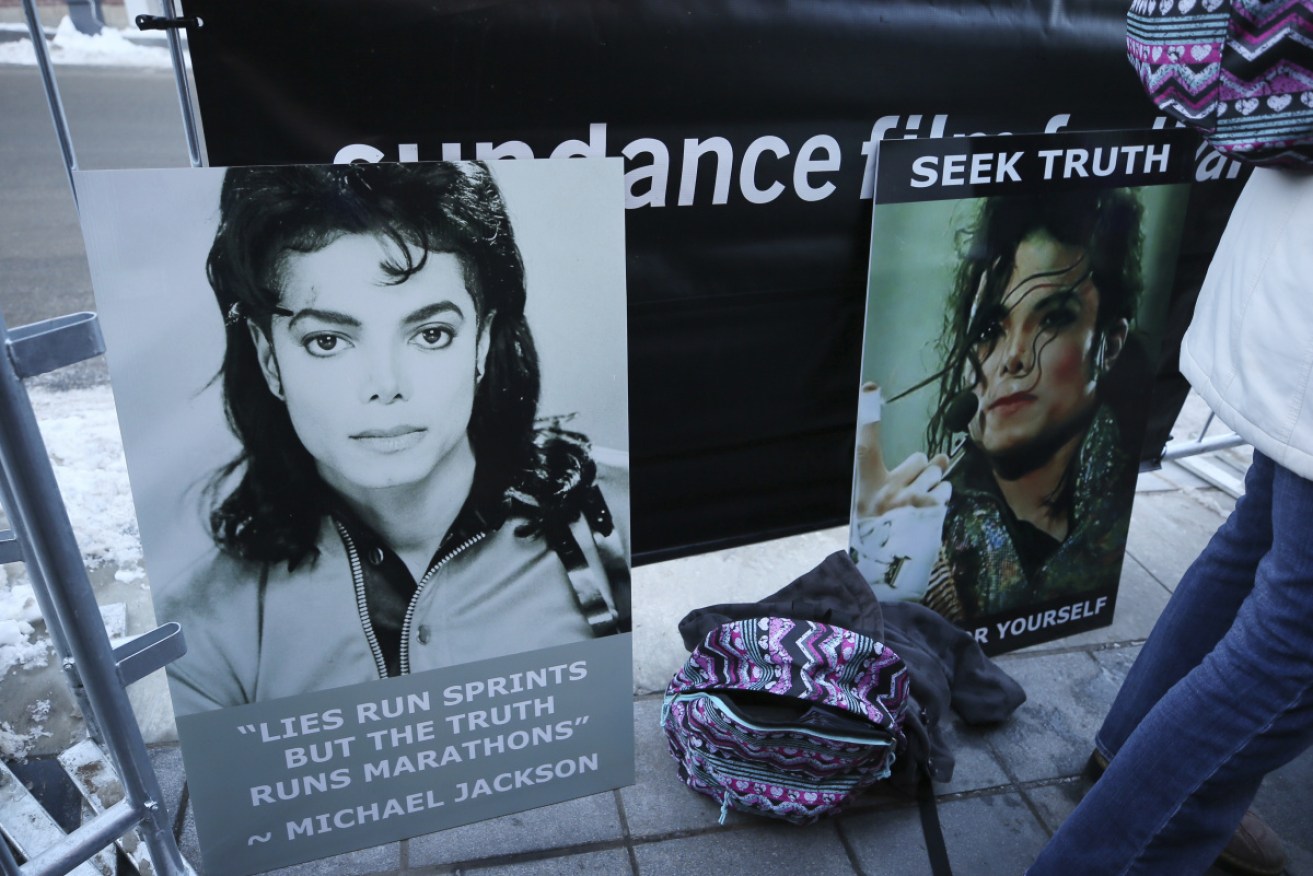 Signs in support of Michael Jackson outside the premiere of 'Leaving Neverland' at the Egyptian Theatre in Park City, Utah.