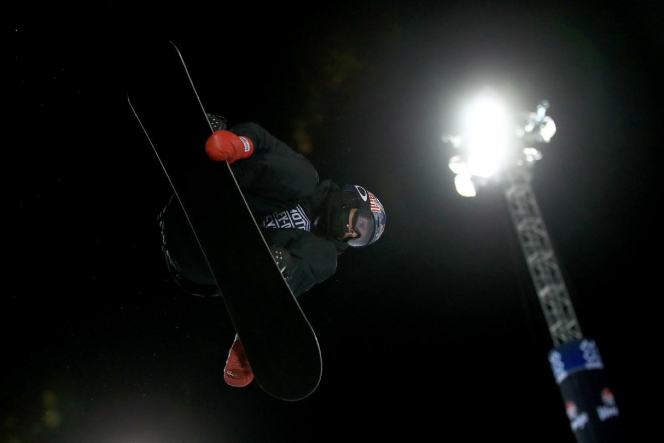 Scotty James flies through the air in the men's snowboard superpipe final at the Winter X Games in Aspen, Colorado.