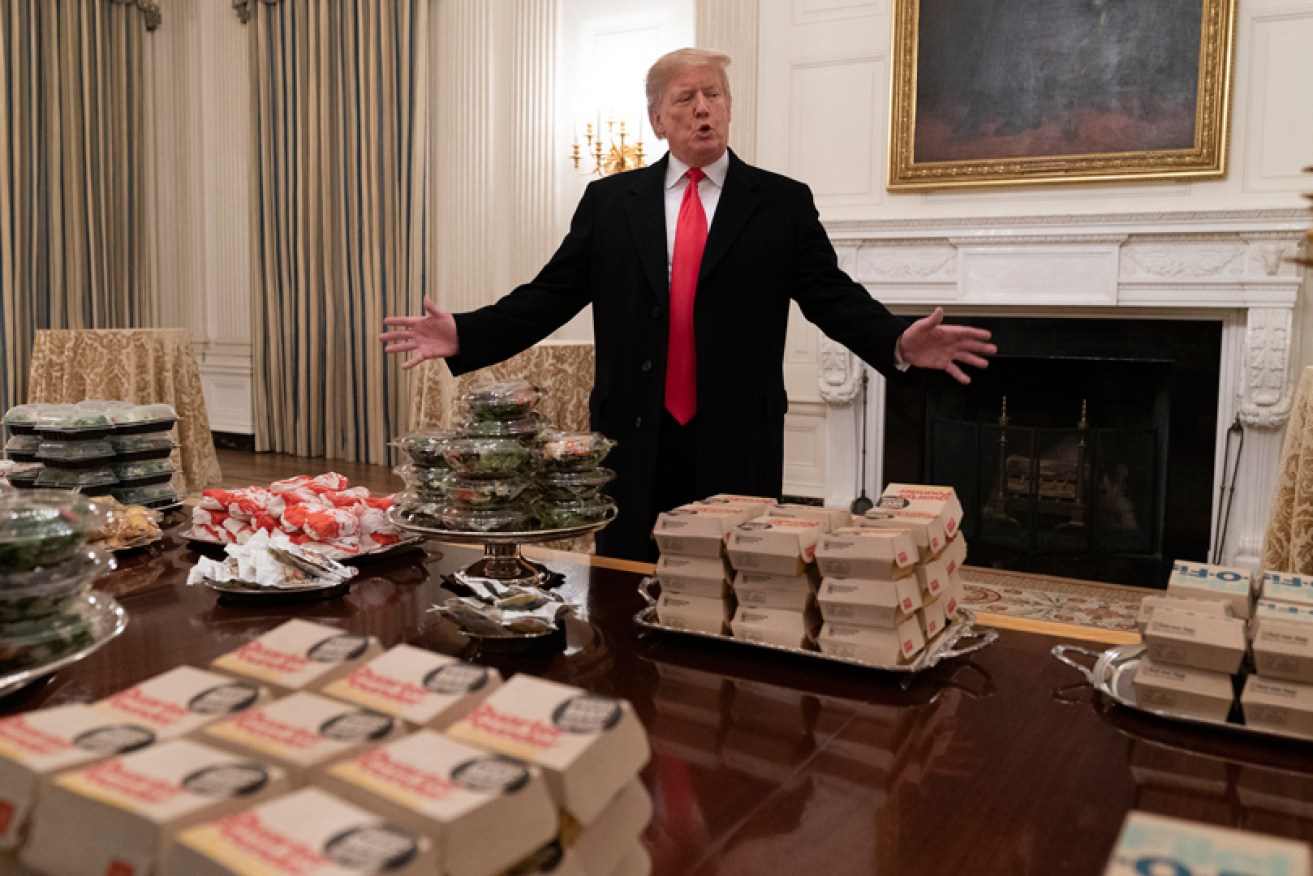 Keen tour guide Donald Trump welcomes college football players to the White House with takeaway on January 14.