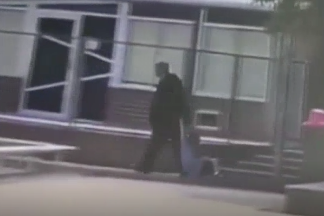 A still image of a viral video showing a principal dragging at a Melbourne school.