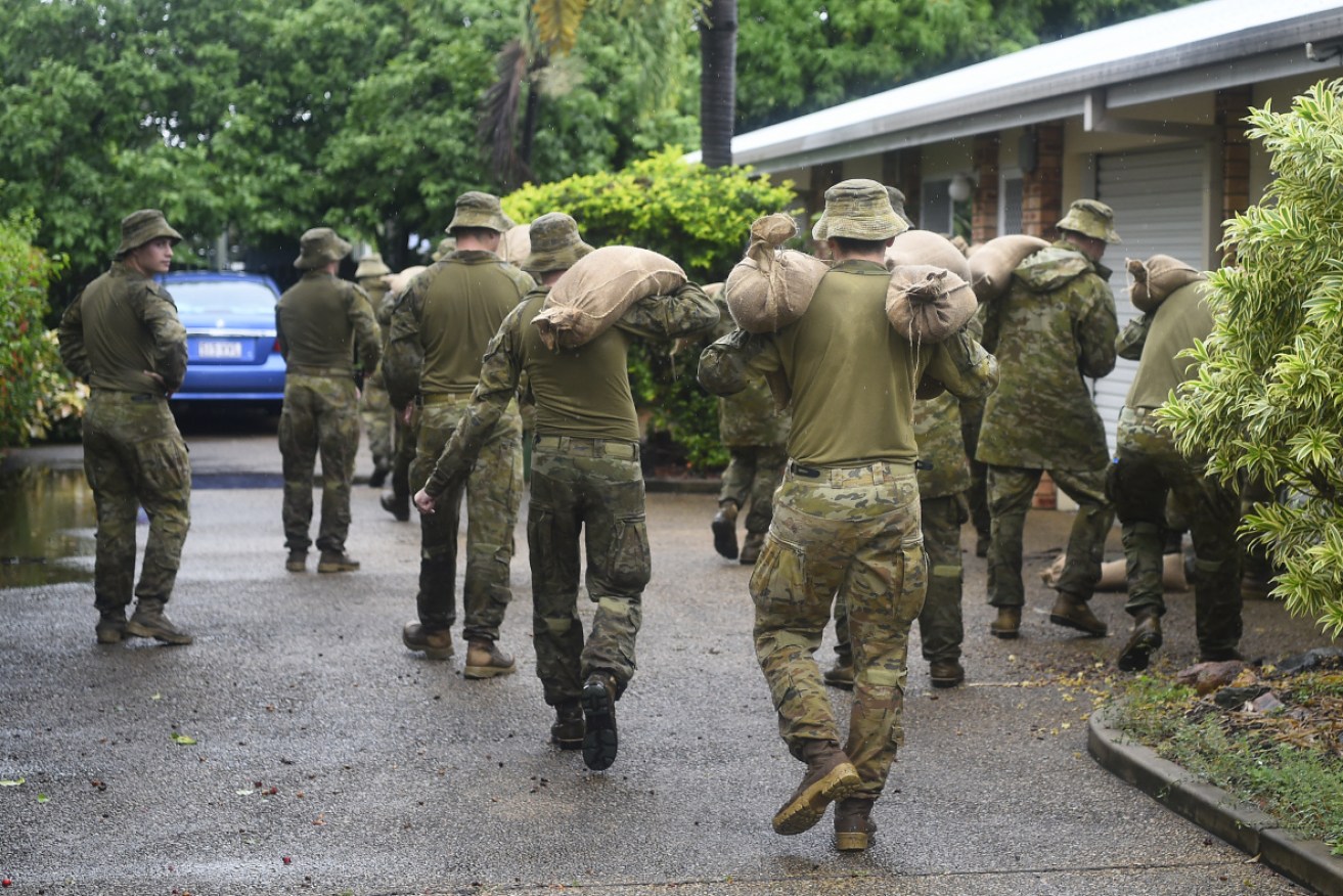 North Queensland remains on high alert as the army steps in with manpower and machines.