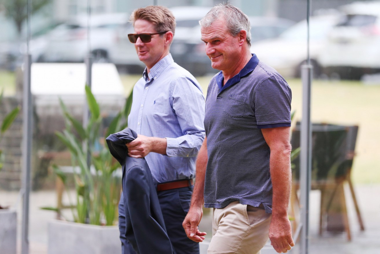 Darren Weir (right) and Jarrod McLean arrive at Racing Victoria in January 2019. headquarters for a hearing on Monday.