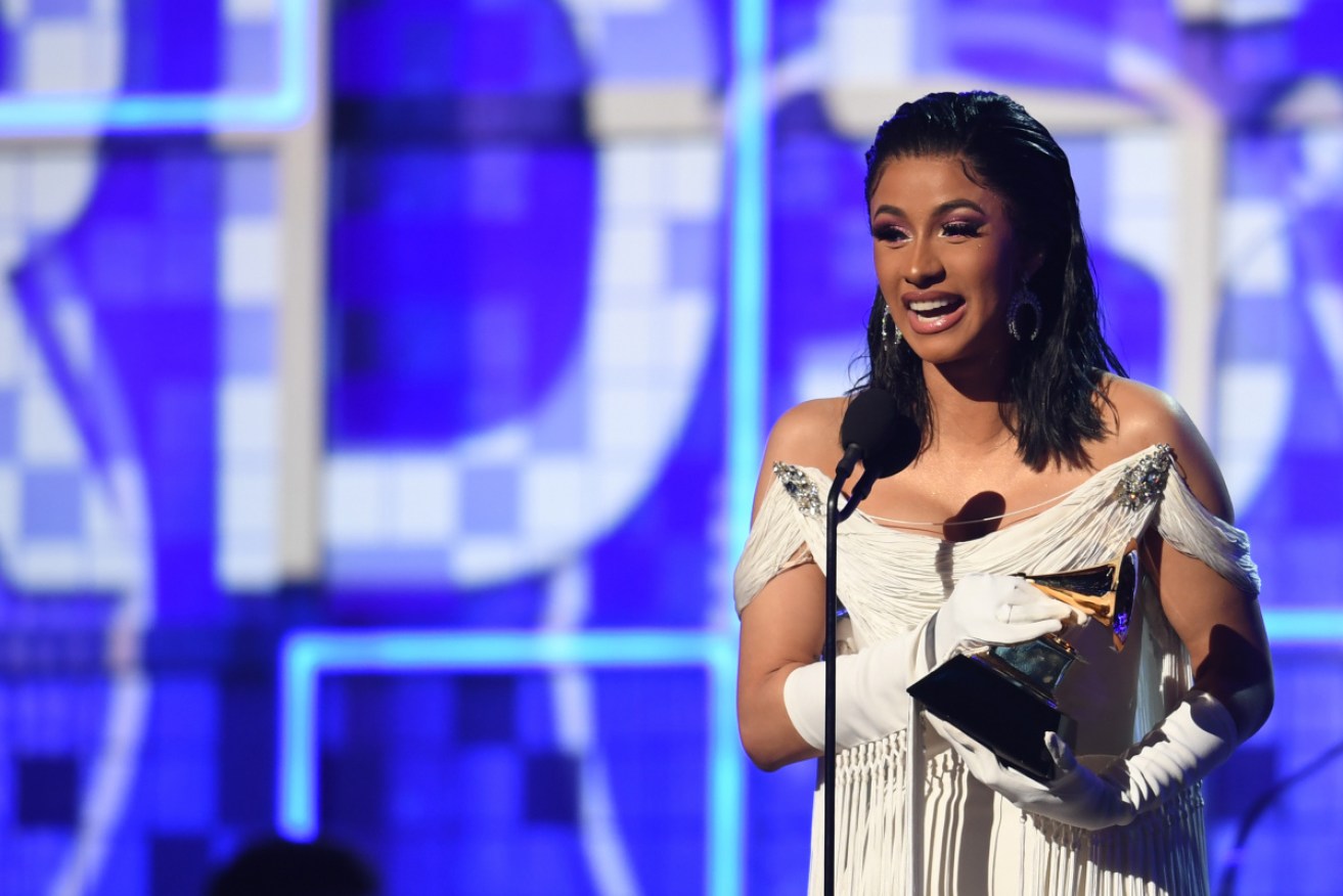 Cardi B accepts the award for Best Rap Album with Invasion of Privacy.