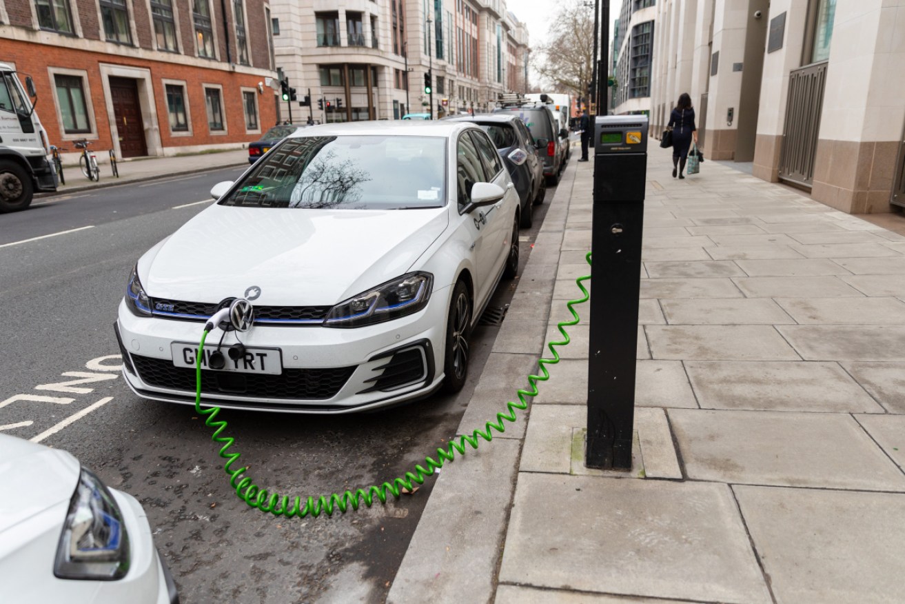 An electric car charges on the street at Westminster in central London. 