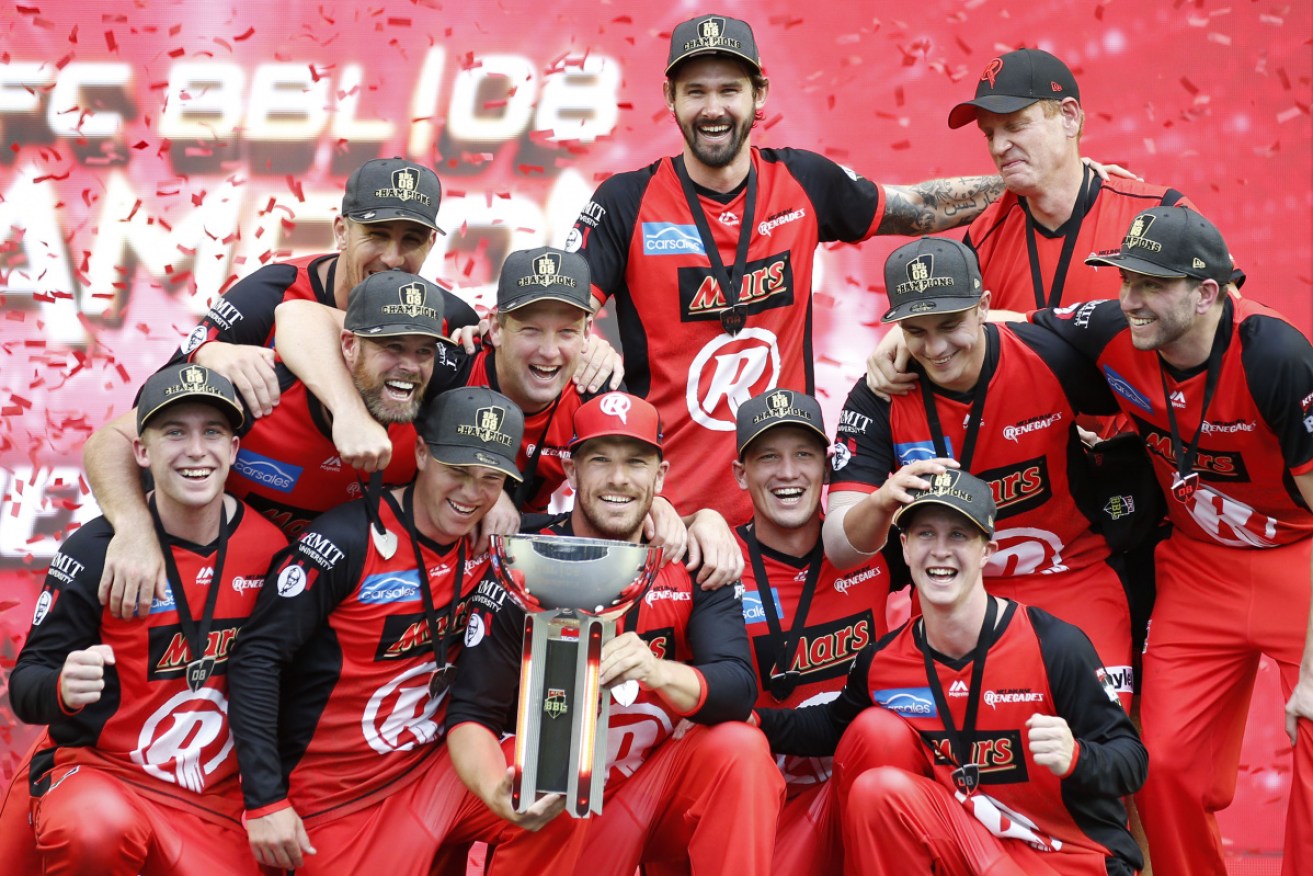 The Melbourne Renegades celebrate their maiden BBL title at Marvel Stadium on Sunday. 