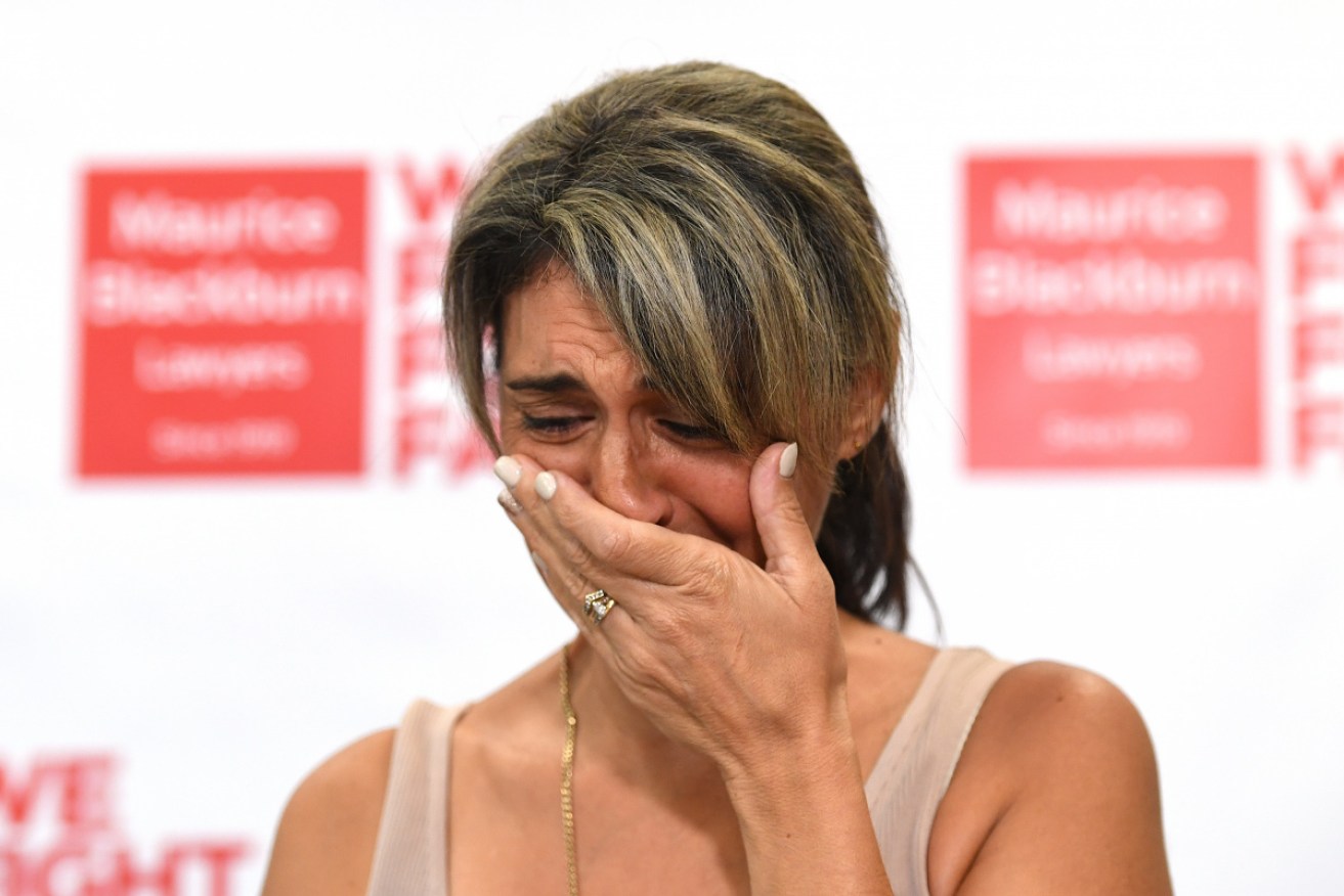 An emotional Michelle Tate at a press conference in Brisbane on Thursday. 
