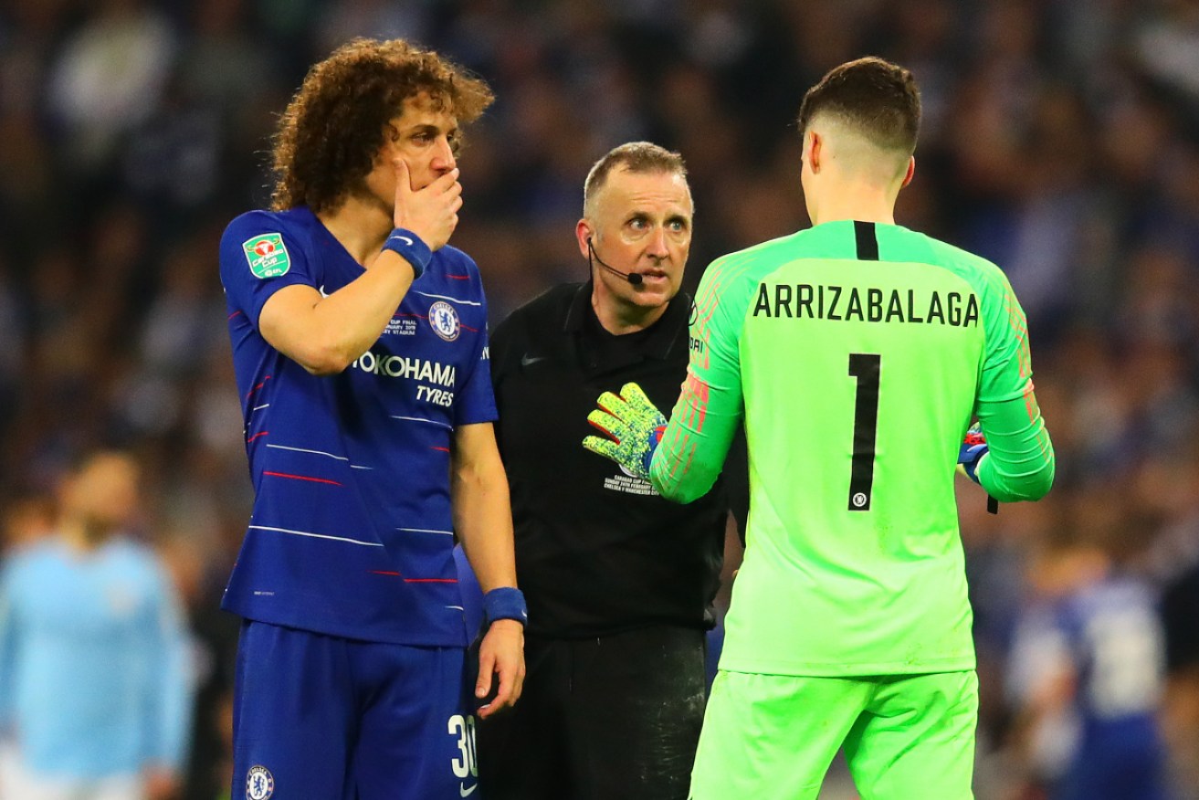 Chelsea's Kepa Arrizabalaga with referee Jonathan Moss during the on-field fracas.