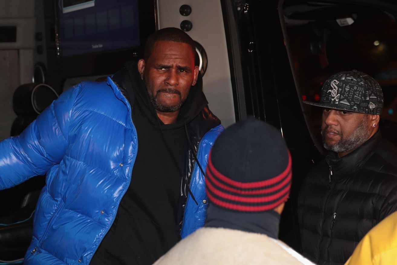 R. Kelly arrives at court in Chicago on Friday. He has been in jail since, having been unable to post bail.