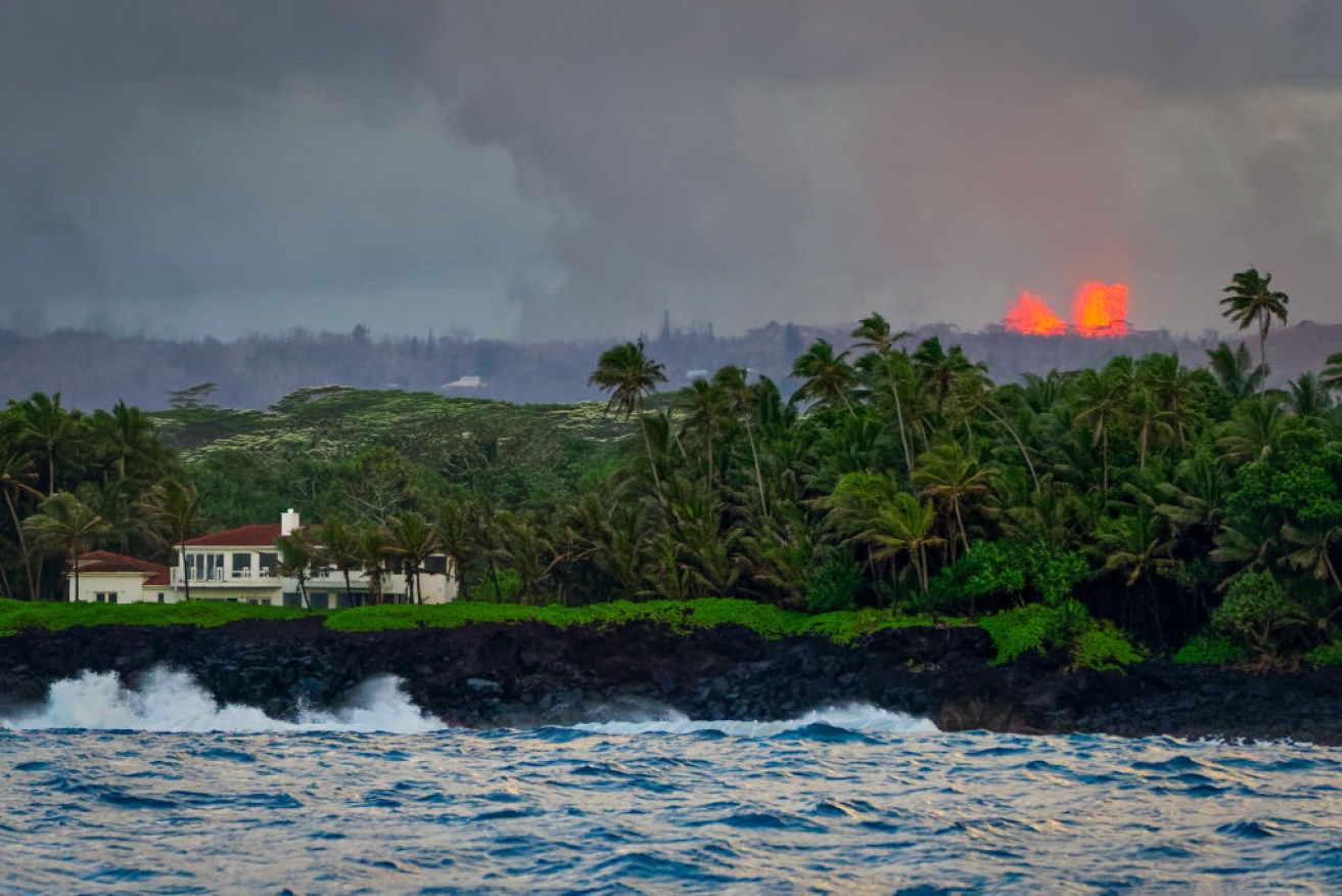 Lava from Kilauea erupts eerily close to houses on the Big Island.