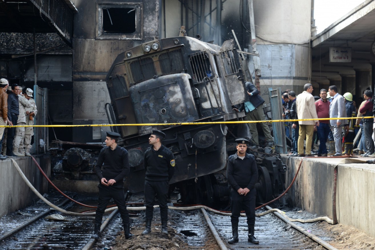 Security staff guard the scene of the horrific incident at Ramses Station, Cairo on Wednesday.  