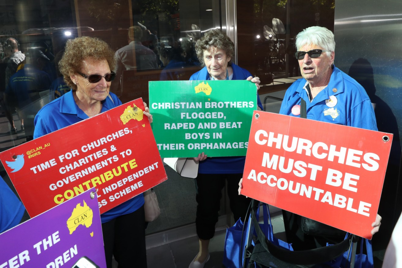 Community split: Protestors were a regular feature outside Cardinal George Pell's court hearings. 