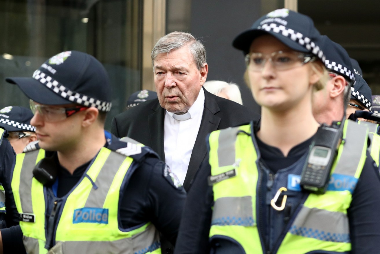 George Pell enters court before his conviction.
