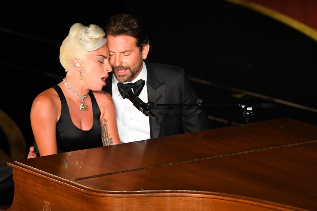 Lady Gaga and Bradley Cooper ignite romance rumours at the Feb. 24 Oscars.