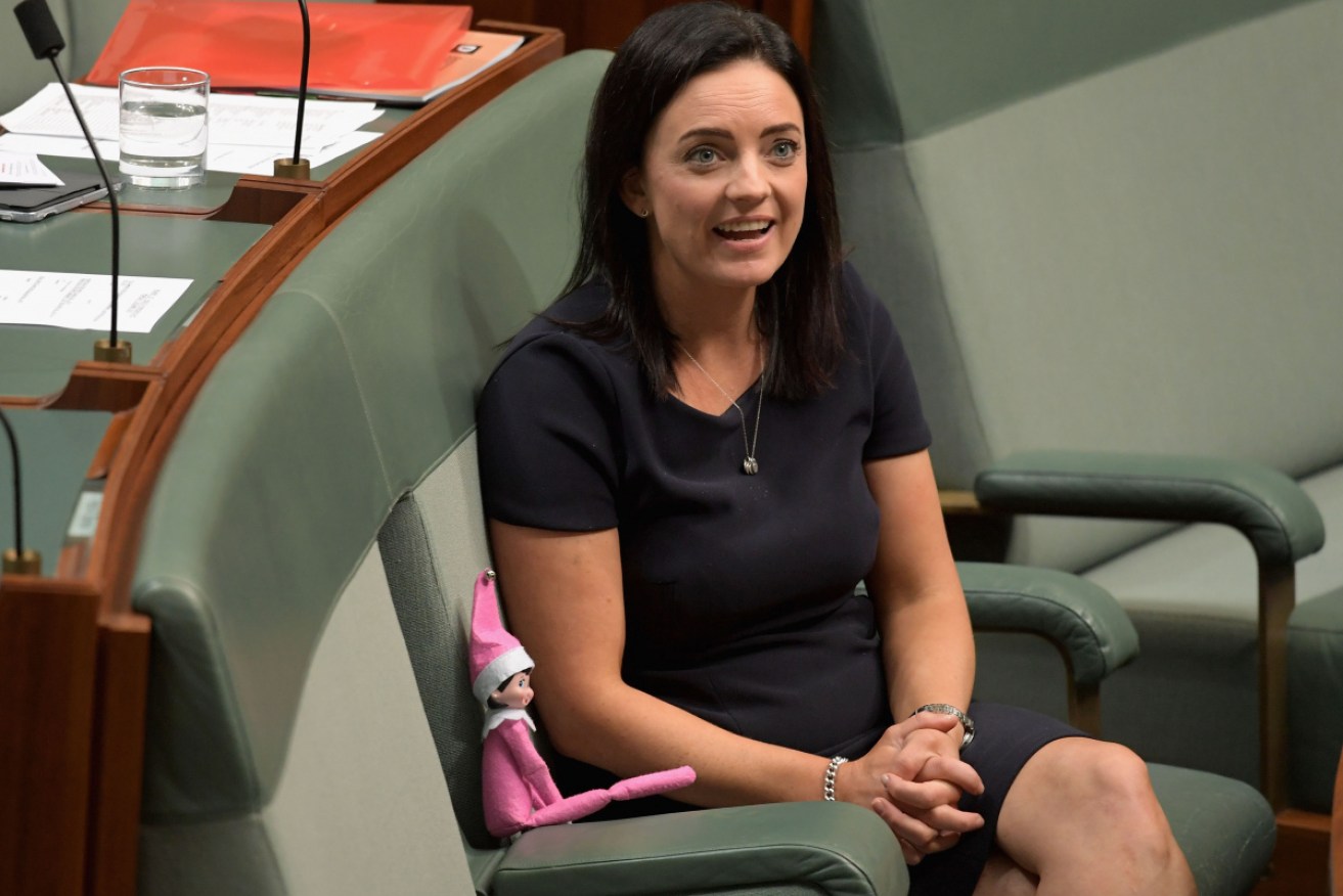 Member for Lindsay Emma Husar sits with an elf on a shelf doll at Parliament House on December 5. 